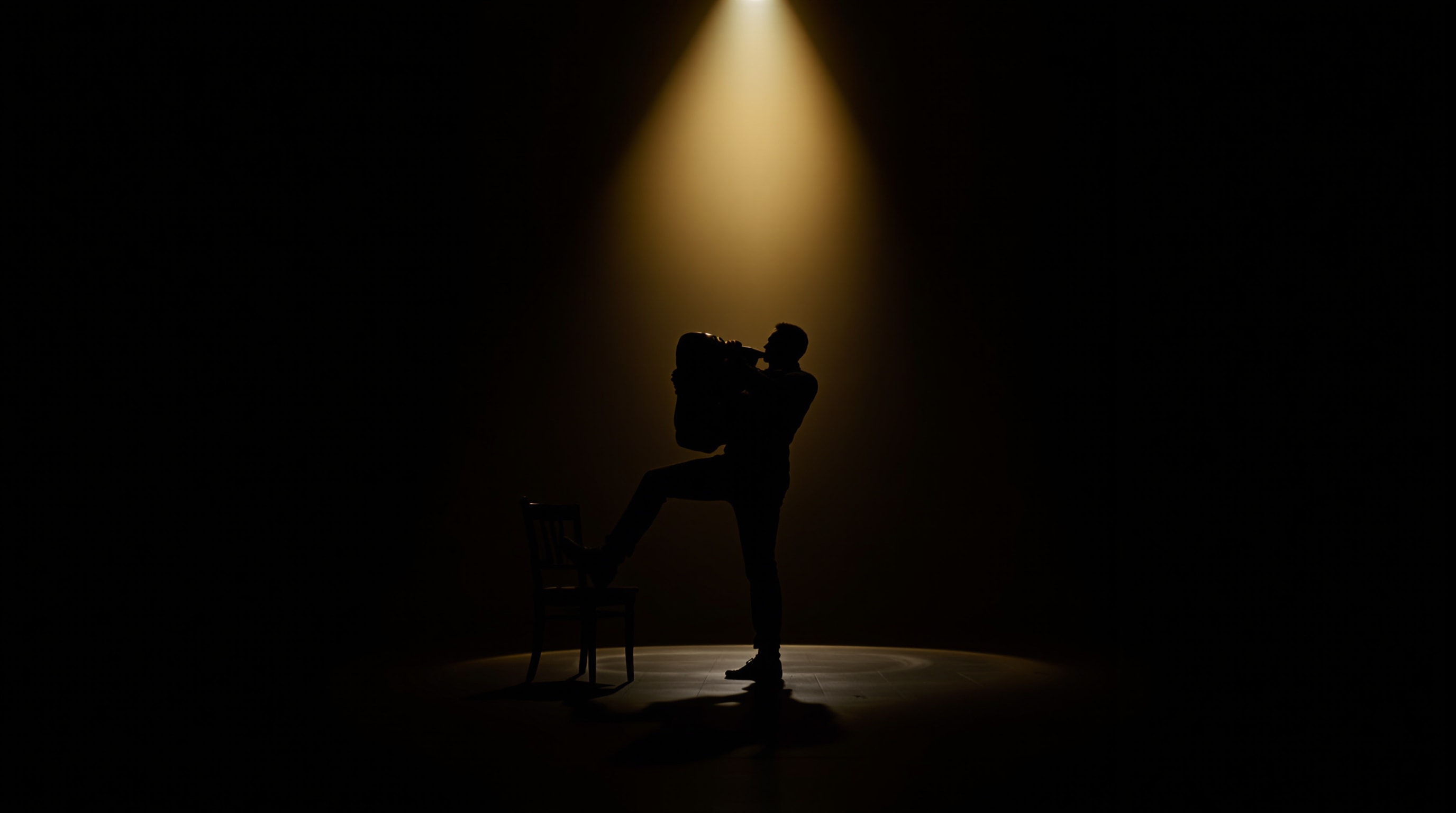 Silhouette of a bandoneón player performing on a darkened stage